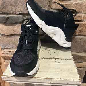 Black and White Sorel INETIC Caribou boots